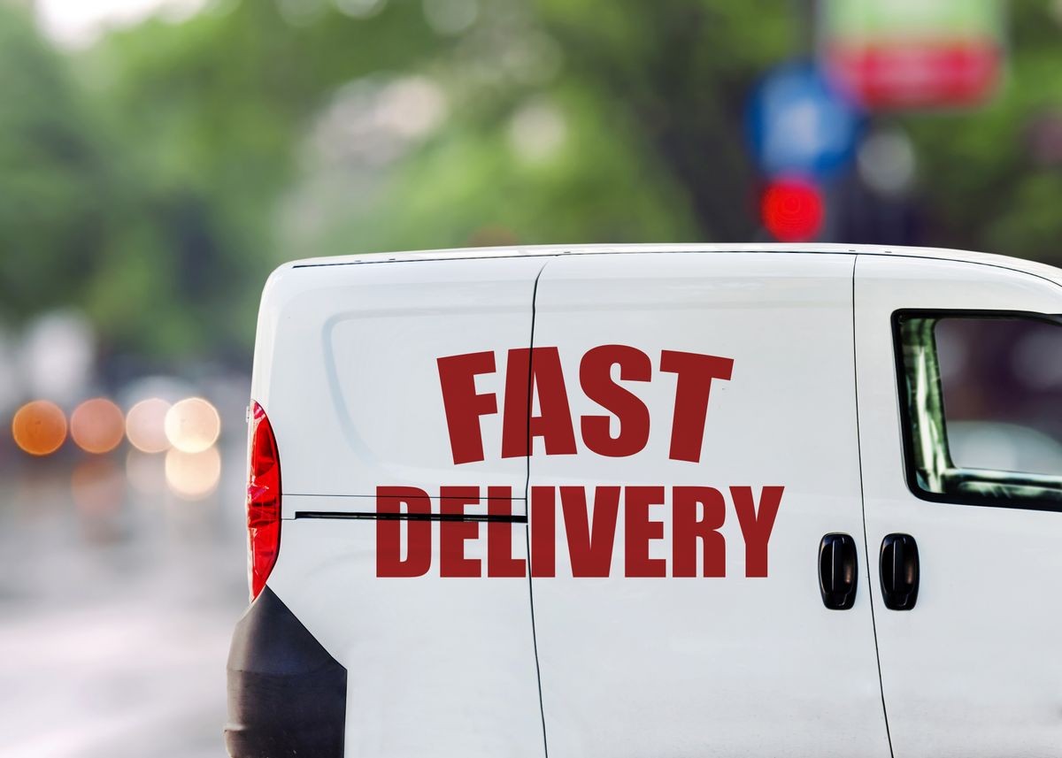 Fast delivery, van on city street 